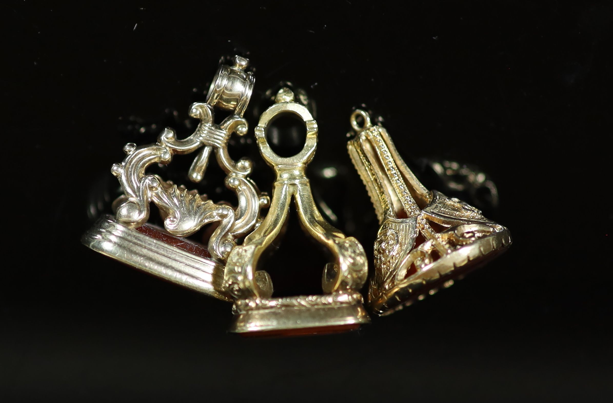 Three assorted gold overlaid and carnelian set fob seals